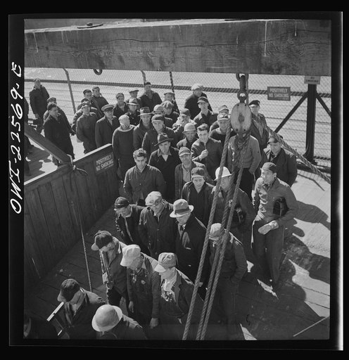 Baltimore, Maryland. Bethlehem Fairfield shipyard workers boarding a former Wilson Line pleasure boat, now used for workers' transportation, to get back to Baltimore from the second shift