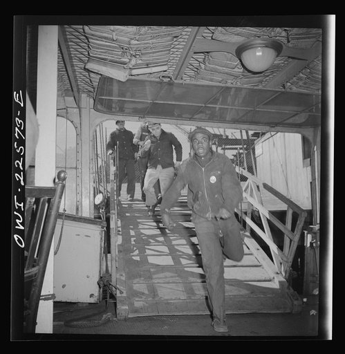 Baltimore, Maryland. Boarding a former Wilson Line boat, now used for transportation. Eighteen hundred men crowd onto the boat for the twenty minute trip across Curtis Bay to the Bethlehem Fairfield shipyard