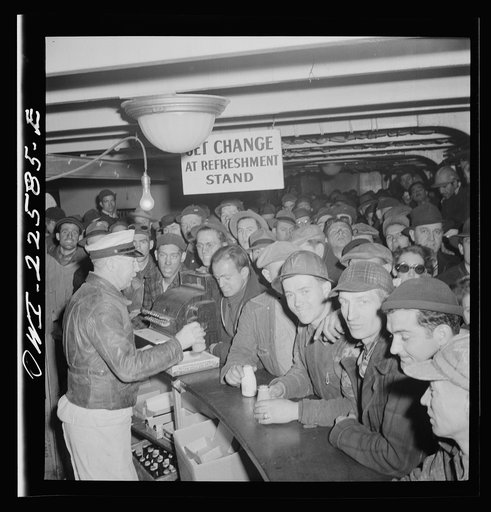 Baltimore, Maryland. Eighteen hundred workers are carried from the Bethlehem Fairfield shipyard to Baltimore on a former Wilson Line pleasure boat. The trip takes twenty minutes drinks