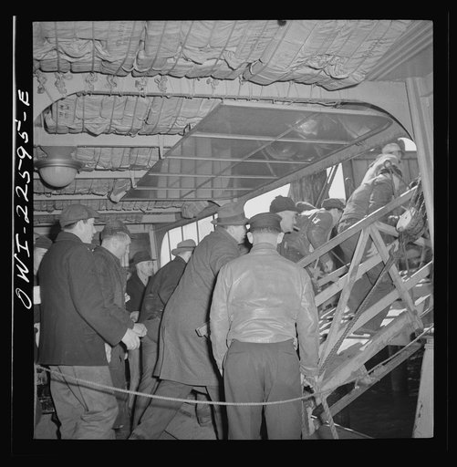 Baltimore, Maryland. Boarding a former Wilson Line boat, now used for transportation. Eighteen hundred men crowd onto the boat for the twenty minute trip across Curtis Bay to the Bethlehem Fairfield shipyard
