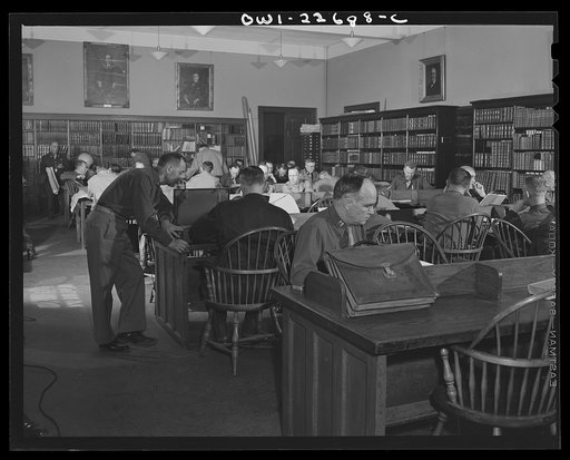Untitled photo, possibly related to: Charlottesville, Virginia. Officers enrolled in the School of Military Government doing research in the Library of International Law at the University of Virginia