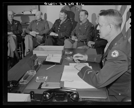 Charlottesville, Virginia. General Wickersham in conference with his staff in the School of Military Government at the University of Virginia
