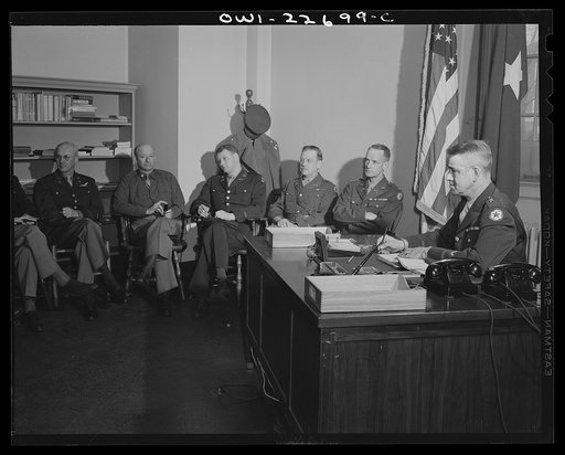Charlottesville, Virginia. General Wickersham in conference with his staff in the School of Military Government at the University of Virginia