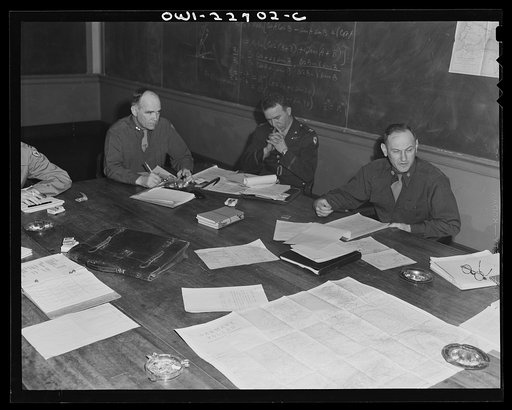 Untitled photo, possibly related to: Charlottesville, Virginia. Officers assigned to the problem of foreign administrative policy in a committee meeting in the School of Military Government at the University of Virginia