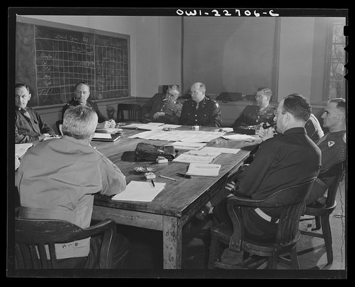 Untitled photo, possibly related to: Charlottesville, Virginia. Officers assigned to the problem of foreign administrative policy in a committee meeting in the School of Military Government at the University of Virginia