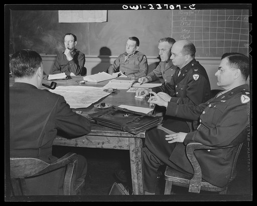 Charlottesville, Virginia. Officers assigned to the problem of foreign administrative policy in a committee meeting in the School of Military Government at the University of Virginia