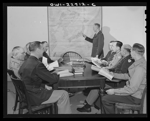 Untitled photo, possibly related to: Charlottesville, Virginia. Committee of ten assigned to the study of Japanese political administration studying tactical problems in the School of Military Government at the University of Virginia