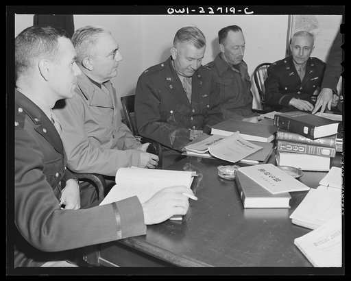 Untitled photo, possibly related to: Charlottesville, Virginia. Committee assigned to the problem of Japanese political policy solving a tactical problem in the School of Military Government at the University of Virginia