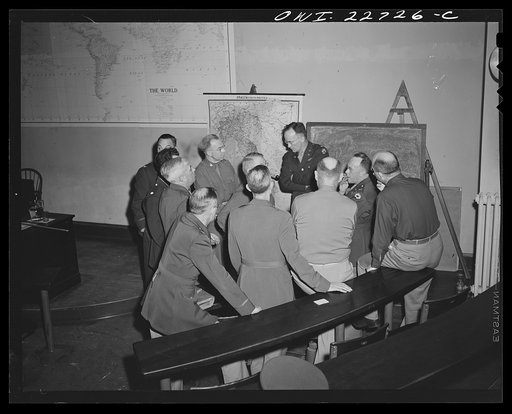 Untitled photo, possibly related to: Charlottesville, Virginia. Officers enrolled in the School of Military Government gathered in informal discussion in the lecture hall of the School of Law, University of Virginia