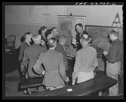 Charlottesville, Virginia. Officers enrolled in the School of Military Government gathered in informal discussion in the lecture hall of the School of Law, University of Virginia