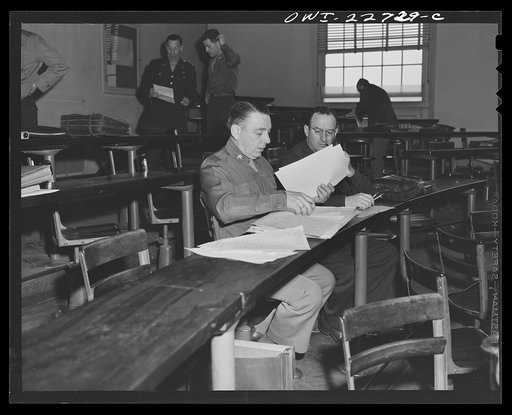 Charlottesville, Virginia. Officers enrolled in the School of Military Government reviewing notes taken down during lecture on foreign administrative policies, held in the School of Law at the University of Virginia