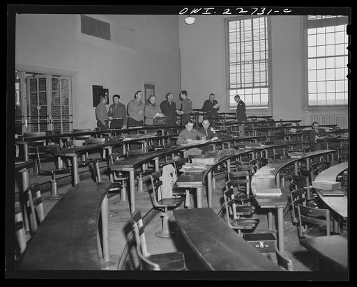 Untitled photo, possibly related to: Charlottesville, Virginia. Officers enrolled in the School of Military Government reviewing notes taken down during lecture on foreign administrative policies, held in the School of Law at the University of Virginia