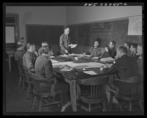Charlottesville, Virginia. A captain who is enrolled in the School of Military Government at the University of Virginia, addressing committee of ten assigned to the problem of foreign administrative policy