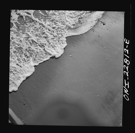Long Beach, California. Sea foam, which forms as the waves break on the shore