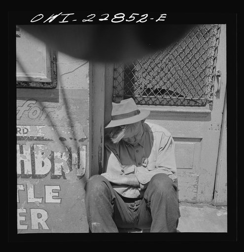New Orleans, Louisiana. Man sleeping in a doorway