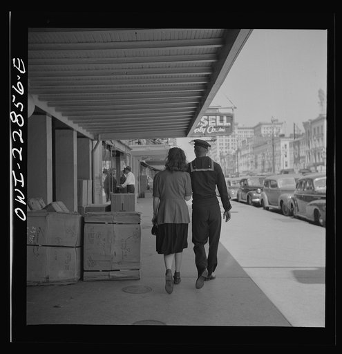 New Orleans, Louisiana. Sailor and girl on Canal Street