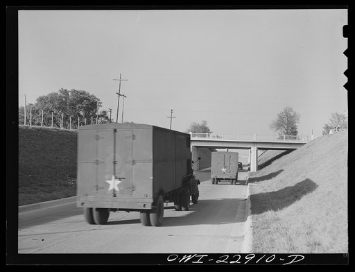Burton,Texas. Army trucks on Highway 290 heading towards Brenham, Texas