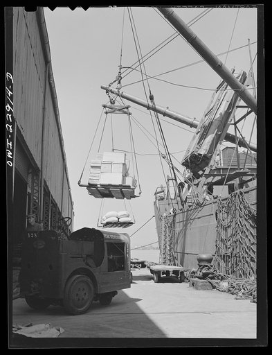 New Orleans, Louisiana. Loading goods onto a ship at the Poydras Street dock