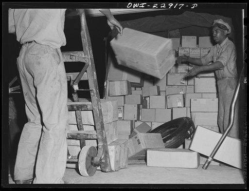 New Orleans, Louisiana. Loading trucks at the Associated Transport Company terminal