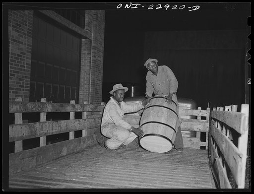 New Orleans, Louisiana. Unloading a local pickup truck at the Associated Transport Company terminal