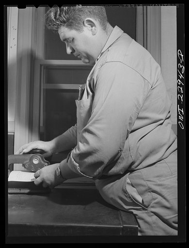 Lake Charles, Louisiana. Joe Morvain, enroute to Houston, stopping to punch a time clock