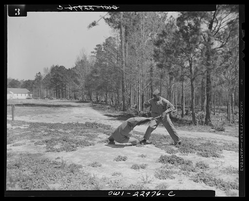 Camp Lejeune, New River, North Carolina. A Negro enlistee of the 51st Composite Battalion, U.S. Marine Corps, learning how to disarm a soldier