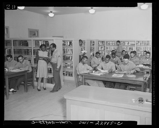Camp Lejeune, New River, North Carolina. Scene in the library showing members of the 51st Composite Battalion, U.S. Marine Corps, studying