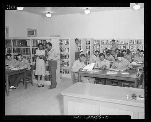 Camp Lejeune, New River, North Carolina. Scene in the library showing members of the 51st Composite Battalion, U.S. Marine Corps, studying