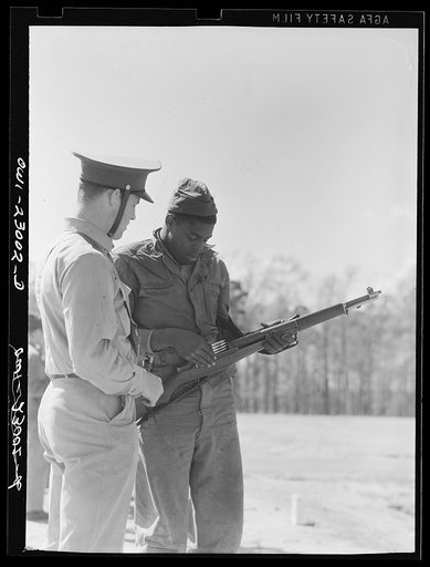Camp Lejeune, New River, North Carolina. Enlistee of the 51st Composite Battalion, U.S. Marine Corps, learning how to load a thirty calibre rifle