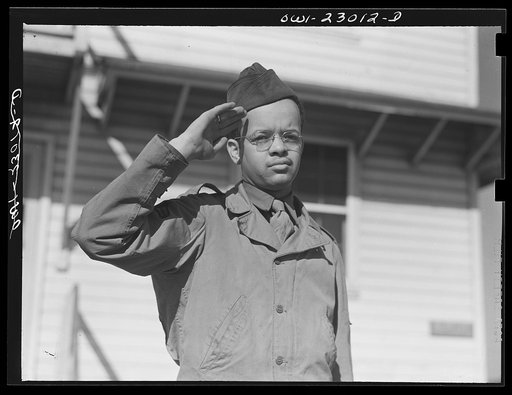 Camp Lejeune, New River, North Carolina. Negro Marine Corps enlistee saluting