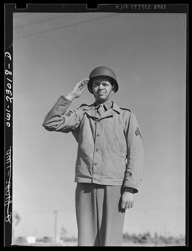 Camp Lejeune, New River, North Carolina. Negro Marine Corps enlistee saluting