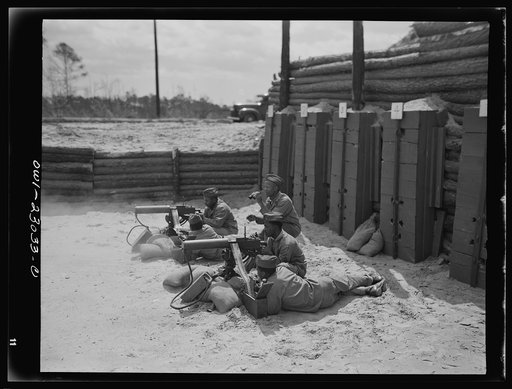 Camp Lejeune, New River, North Carolina. Engineers of the 51st Composite Battalion, U.S. Marine Corps, firing a thirty calibre machine gun on the range
