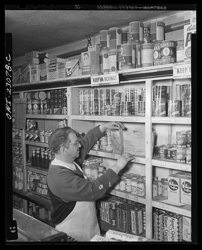 Washington, D.C. This grocer used paper bags for each denomination for his stamps, which must be surrendered by customers under the point rationing system