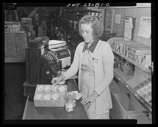 Washington, D.C. Blue and red point stamps are kept in cheese boxes containing paper cups. Mason jars are used for sugar and coffee stamps, which must be surrendered by customers under the point rationing system