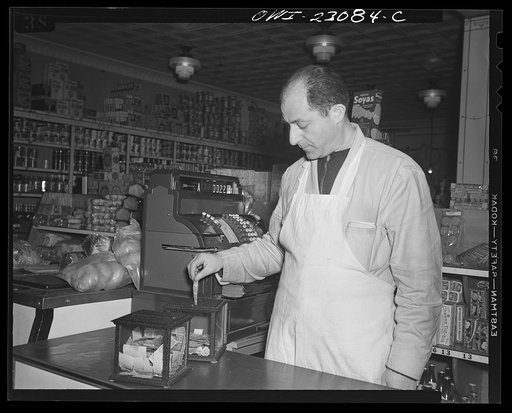Untitled photo, possibly related to: Washington, D.C. These metal and glass containers are commercially made. One is used for blue stamps, the other for red stamps which must be surrendered by customers under the point rationing system