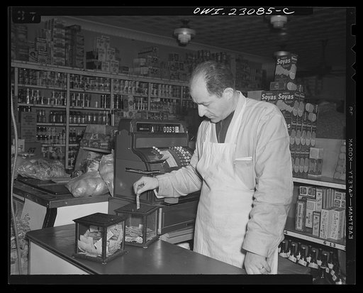 Washington, D.C. These metal and glass containers are commercially made. One is used for blue stamps, the other for red stamps which must be surrendered by customers under the point rationing system