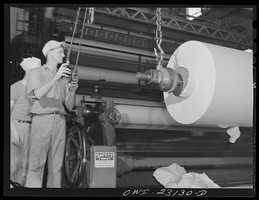 Untitled photo, possibly related to: Lufkin, Texas. Southland paper mill. Newsprint rolling out at the end of a paper machine