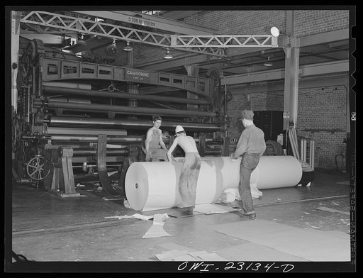 Untitled photo, possibly related to: Lufkin, Texas. Southland paper mill. Newsprint rolling out at the end of a paper machine