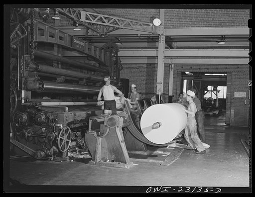 Lufkin, Texas. Southland paper mill. Roll of newsprint coming off the end of the cutting machine