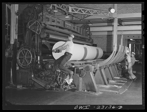 Lufkin, Texas. Southland paper mill. Moving finished roll of newsprint from the paper machine to the cutting machine