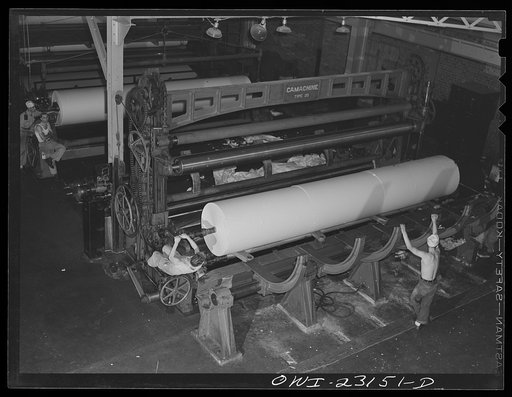 Lufkin, Texas. Southland paper mill. Rolls of newsprint coming off the winding machine where it has been cut to the size ordered by customers