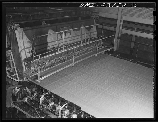 Lufkin, Texas. Southland paper mill. Wet end of a paper machine. Water is drawn from the stock as it flows across a screen and becomes paper