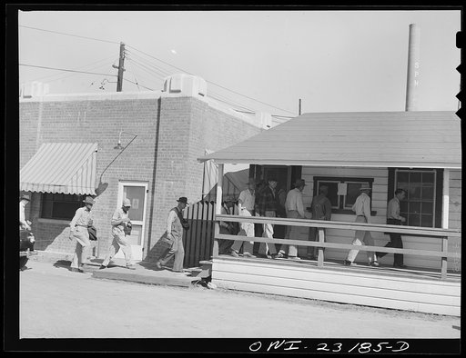 Lufkin, Texas. Southland paper mill. Employees checking out at the time office