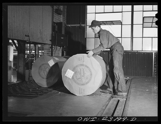 Lufkin, Texas. Southland paper mill. Putting a wrapped roll of newsprint on an elevator which takes it down to the shipping room