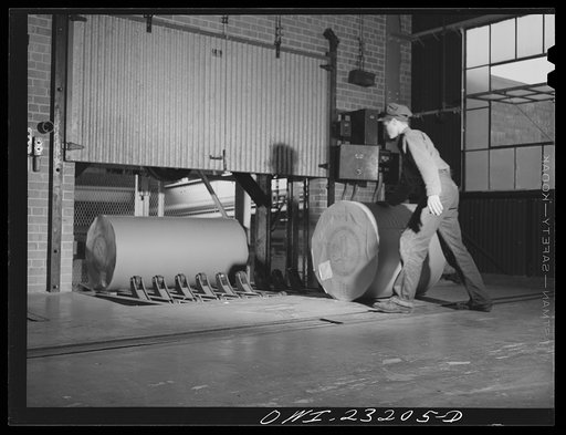 Lufkin, Texas. Southland paper mill. Putting wrapped rolls of newsprint on the elevator which takes them down to the shipping room