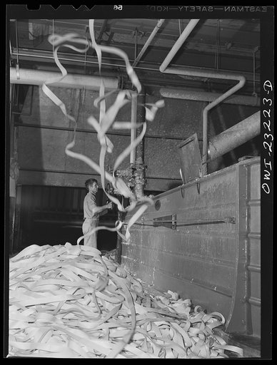 Lufkin, Texas. Southland paper mill. Trimmed edges from cut rolls of newsprint being sent downstairs where they are put in vats and converted back to pulp