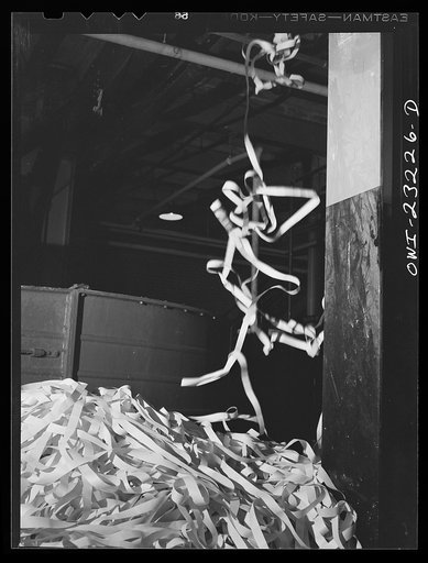 Lufkin, Texas. Southland paper mill. Trimmed edges from cut rolls of newsprint being sent downstairs where they are put in vats and converted back to pulp