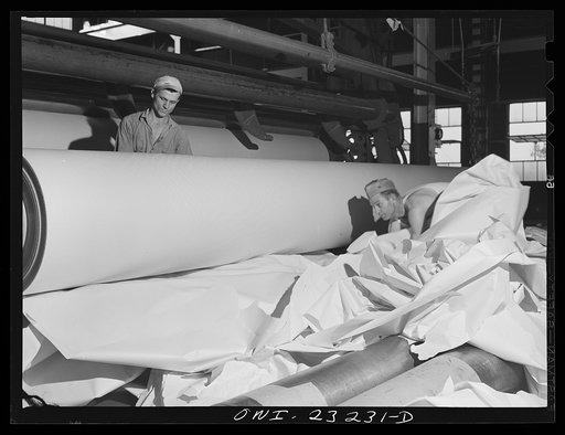 Lufkin, Texas. Southland paper mill. Removing waste paper after a break in the machine