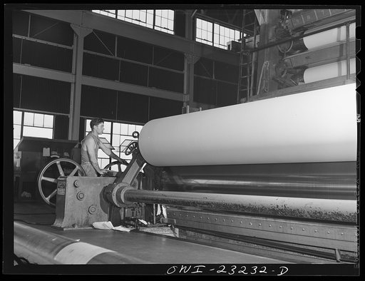 Lufkin, Texas. Southland paper mill. An eighteen foot roll of newsprint coming off the end of the paper machine