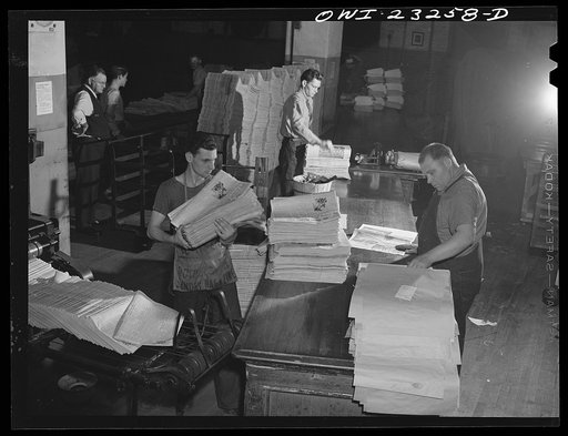 Dallas, Texas. Mail room at the Dallas Morning News. In the lower left corner papers are coming up off the presses